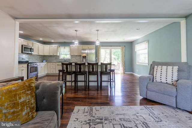 3305 Baker Ct, Altoona, PA 16602 - living room with dark wood finished floors, plenty of natural light, baseboards, and recessed lighting