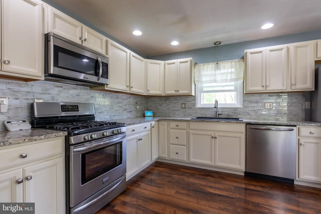 3305 Baker Ct, Altoona, PA 16602 - kitchen with stainless steel appliances, a sink, dark wood-style floors, light stone counters, and recessed lighting