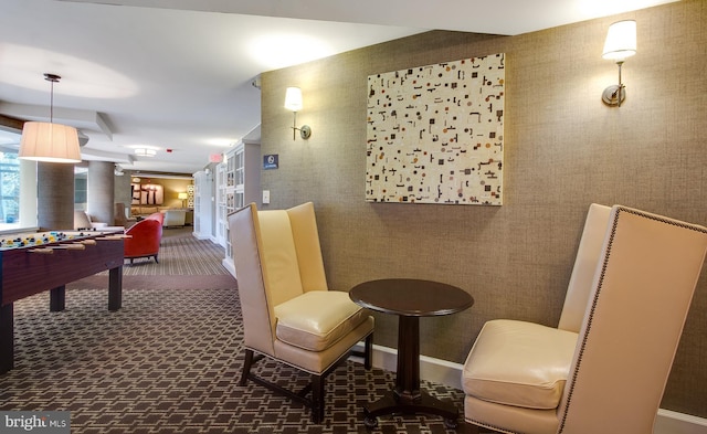rec room featuring decorative columns, wallpapered walls, carpet, and baseboards