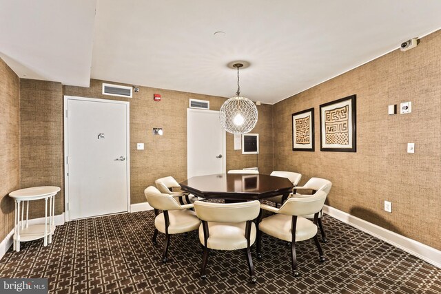dining space featuring baseboards and visible vents