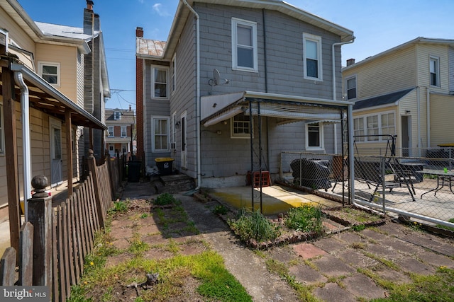 back of house with a patio area and a fenced backyard