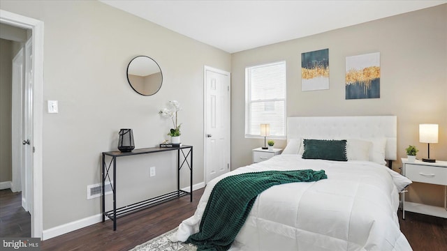 5427 Gradin Ave, Gwynn Oak, MD 21207 - bedroom with visible vents, baseboards, and wood finished floors