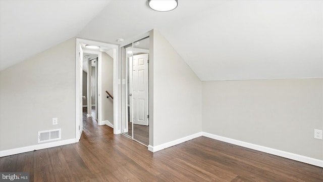 5427 Gradin Ave, Gwynn Oak, MD 21207 - bonus room featuring wood finished floors, baseboards, lofted ceiling, and visible vents