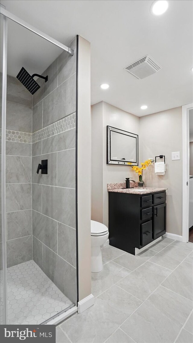 5427 Gradin Ave, Gwynn Oak, MD 21207 - full bath featuring visible vents, toilet, a stall shower, and vanity