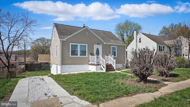 5427 Gradin Ave, Gwynn Oak, MD 21207 - bungalow-style home featuring roof with shingles, a front yard, and fence