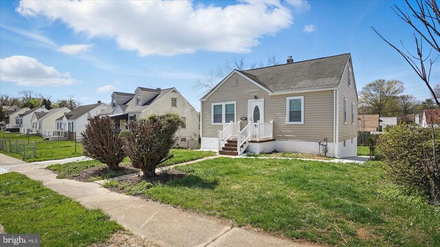5427 Gradin Ave, Gwynn Oak, MD 21207 - bungalow-style house featuring roof with shingles, a residential view, a front yard, and fence