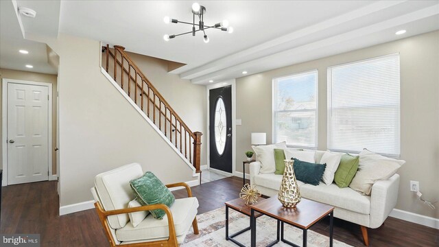5427 Gradin Ave, Gwynn Oak, MD 21207 - living room featuring a chandelier, stairway, baseboards, and wood finished floors