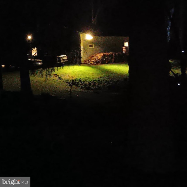 view of yard at night
