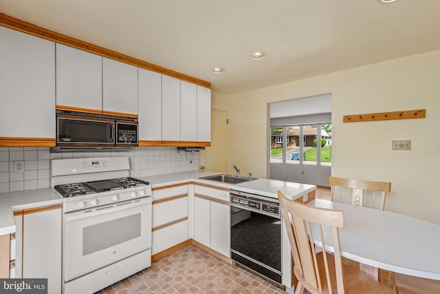2418 Berkshire Ln, Dover, PA 17315 - kitchen featuring black appliances, a sink, backsplash, light countertops, and recessed lighting