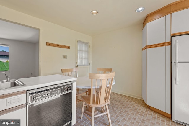 2418 Berkshire Ln, Dover, PA 17315 - kitchen featuring freestanding refrigerator, dishwasher, a sink, white cabinets, and recessed lighting