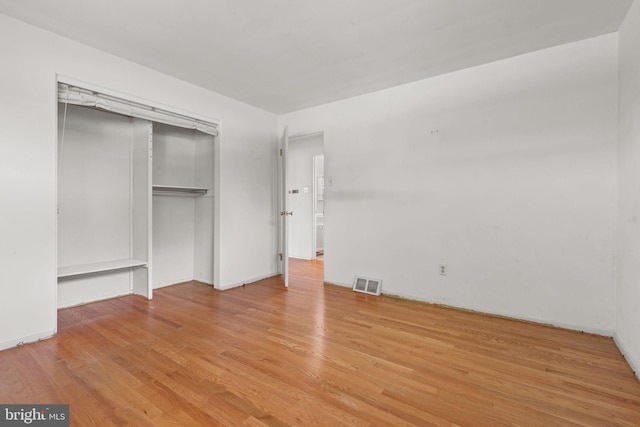 2418 Berkshire Ln, Dover, PA 17315 - unfurnished bedroom with light wood-type flooring, a closet, and baseboards