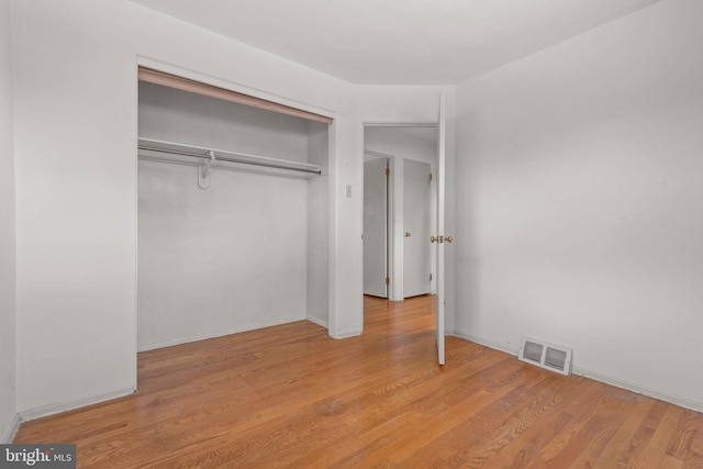 2418 Berkshire Ln, Dover, PA 17315 - unfurnished bedroom featuring wood finished floors, a closet, and baseboards