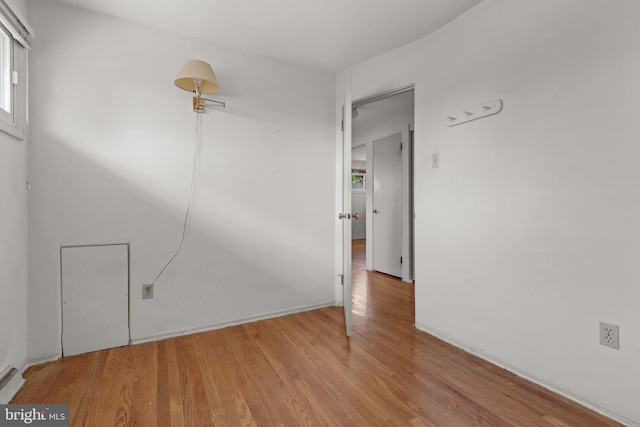 2418 Berkshire Ln, Dover, PA 17315 - empty room featuring light wood-type flooring, a baseboard heating unit, and baseboards