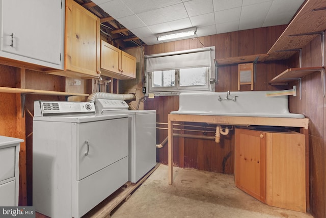2418 Berkshire Ln, Dover, PA 17315 - washroom with cabinet space, washer and clothes dryer, and wooden walls