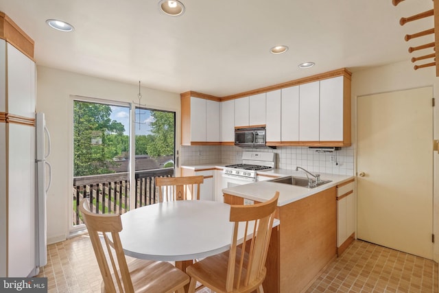 2418 Berkshire Ln, Dover, PA 17315 - kitchen featuring white appliances, decorative backsplash, a sink, light countertops, and recessed lighting