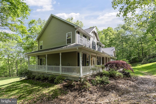 117 Graystone Farm Rd, White Hall, MD 21161 - view of side of home with a porch, a lawn, and a shingled roof