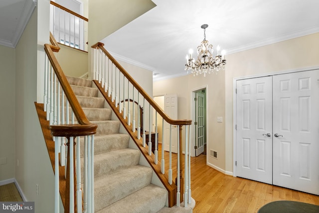 117 Graystone Farm Rd, White Hall, MD 21161 - foyer featuring ornamental molding, stairway, wood finished floors, a chandelier, and baseboards