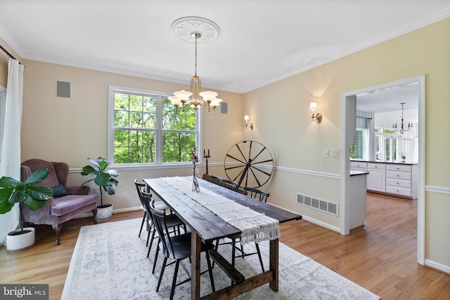 117 Graystone Farm Rd, White Hall, MD 21161 - dining space featuring a chandelier, crown molding, light wood-style floors, and baseboards