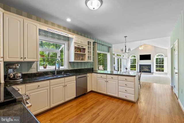 117 Graystone Farm Rd, White Hall, MD 21161 - kitchen featuring stainless steel dishwasher, a sink, light wood-style flooring, a peninsula, and vaulted ceiling