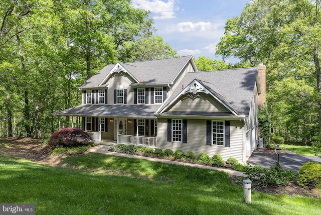 117 Graystone Farm Rd, White Hall, MD 21161 - view of front of home with covered porch, a chimney, a front lawn, and a garage