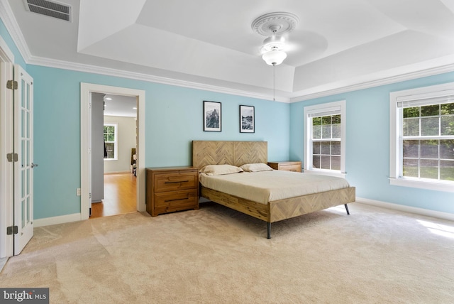 117 Graystone Farm Rd, White Hall, MD 21161 - bedroom with a tray ceiling, light carpet, multiple windows, crown molding, and baseboards