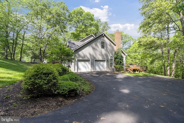 117 Graystone Farm Rd, White Hall, MD 21161 - view of side of home featuring driveway, a chimney, and a wooden deck