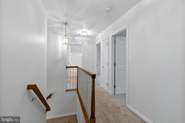 117 Graystone Farm Rd, White Hall, MD 21161 - hallway with an upstairs landing, carpet floors, and baseboards