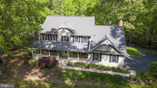 117 Graystone Farm Rd, White Hall, MD 21161 - view of front of home with covered porch, a chimney, and a view of trees