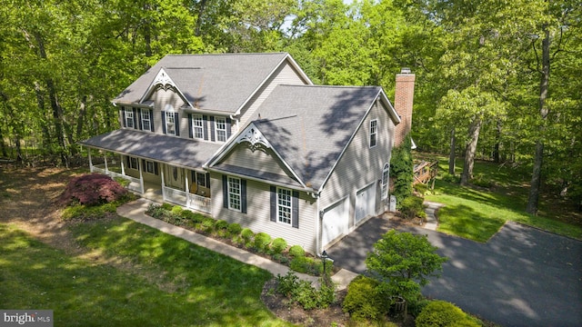 117 Graystone Farm Rd, White Hall, MD 21161 - view of front of property with covered porch, asphalt driveway, an attached garage, a chimney, and a front yard