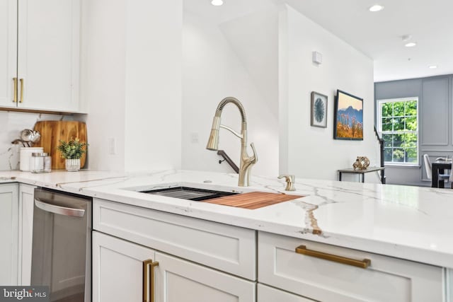 322 56th St NE, Washington, DC 20019 - kitchen with light stone countertops, a sink, recessed lighting, and stainless steel dishwasher