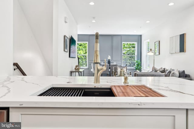 322 56th St NE, Washington, DC 20019 - kitchen featuring light stone countertops, open floor plan, and recessed lighting