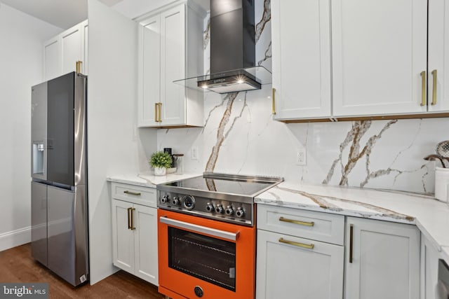 322 56th St NE, Washington, DC 20019 - kitchen with wall chimney exhaust hood, stainless steel appliances, dark wood-type flooring, light stone countertops, and decorative backsplash