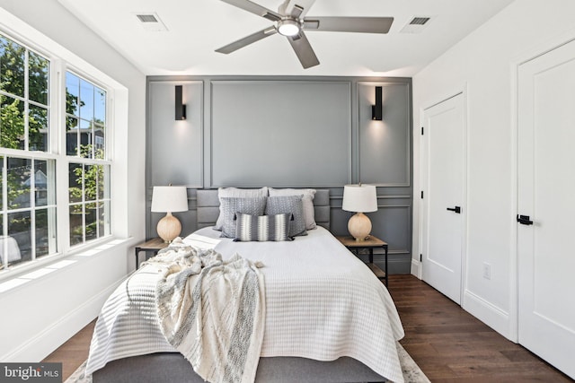 322 56th St NE, Washington, DC 20019 - bedroom featuring baseboards, visible vents, a ceiling fan, and wood finished floors