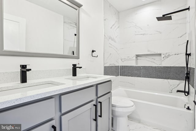 322 56th St NE, Washington, DC 20019 - bathroom with double vanity, toilet, marble finish floor, and a sink