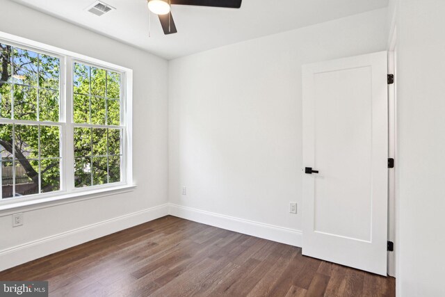 322 56th St NE, Washington, DC 20019 - empty room featuring a ceiling fan, baseboards, dark wood finished floors, and visible vents