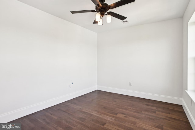 322 56th St NE, Washington, DC 20019 - empty room featuring dark wood-style flooring, visible vents, baseboards, and ceiling fan