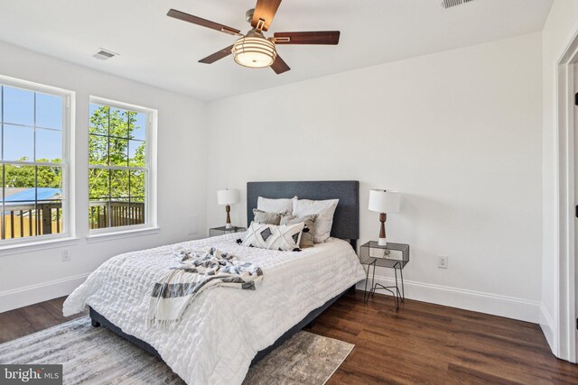 322 56th St NE, Washington, DC 20019 - bedroom featuring wood finished floors, visible vents, baseboards, and ceiling fan