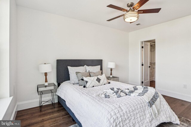 322 56th St NE, Washington, DC 20019 - bedroom with dark wood finished floors, visible vents, baseboards, and ceiling fan