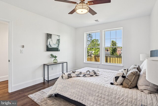 322 56th St NE, Washington, DC 20019 - bedroom featuring ceiling fan, baseboards, dark wood-type flooring, and visible vents