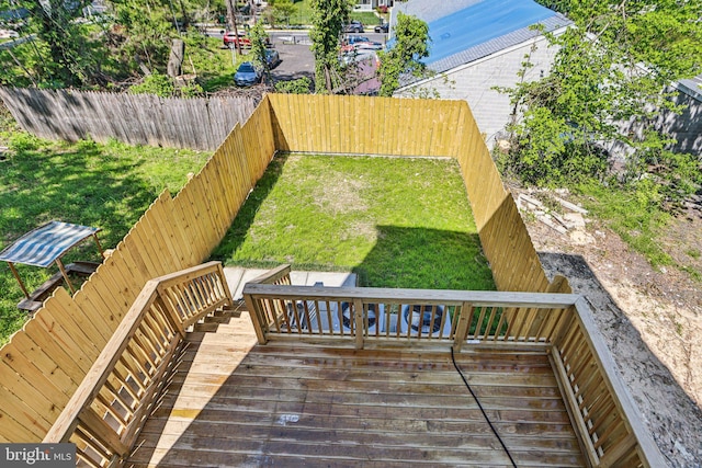 322 56th St NE, Washington, DC 20019 - wooden terrace featuring a fenced backyard and a lawn