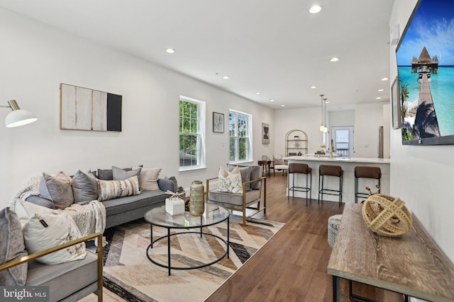 322 56th St NE, Washington, DC 20019 - living room featuring wood finished floors, a healthy amount of sunlight, and recessed lighting