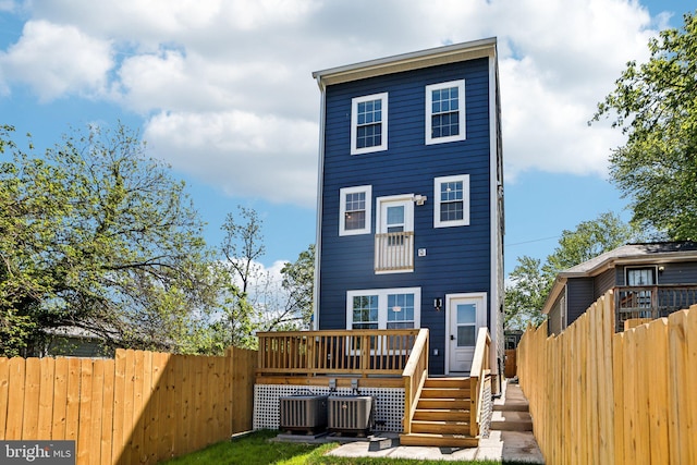 322 56th St NE, Washington, DC 20019 - back of property with central air condition unit, a deck, and fence