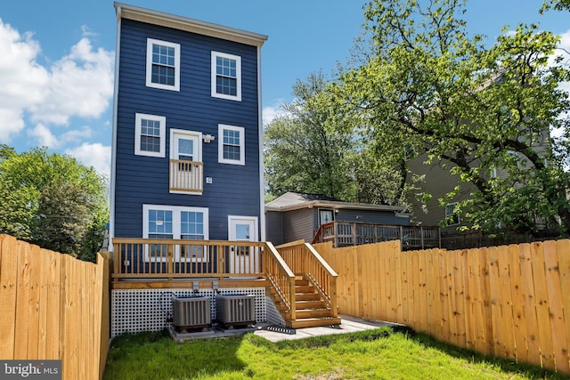 322 56th St NE, Washington, DC 20019 - rear view of house with stairs, a wooden deck, a fenced backyard, and central AC