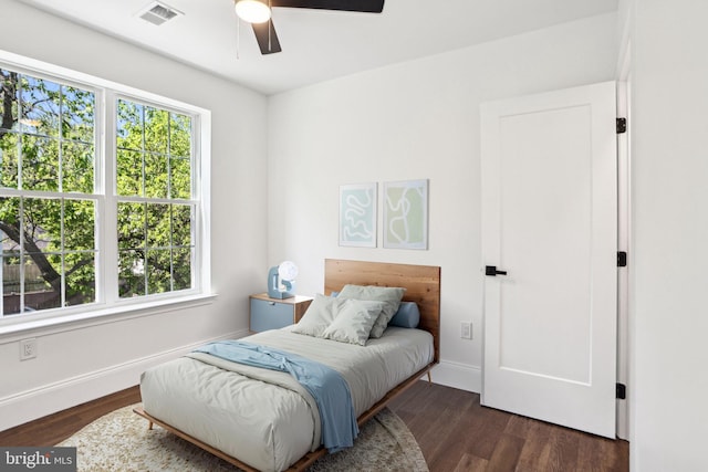 322 56th St NE, Washington, DC 20019 - bedroom with a ceiling fan, baseboards, dark wood-type flooring, and visible vents