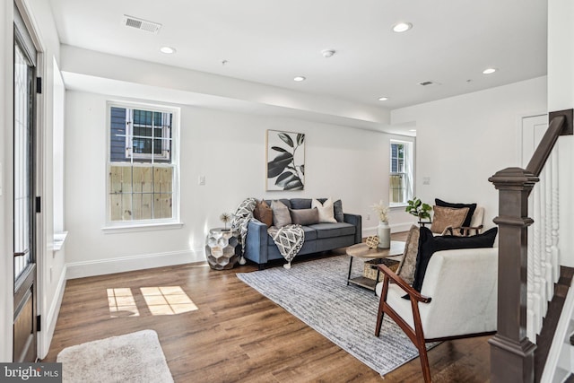 322 56th St NE, Washington, DC 20019 - living area featuring wood finished floors, recessed lighting, visible vents, baseboards, and stairs