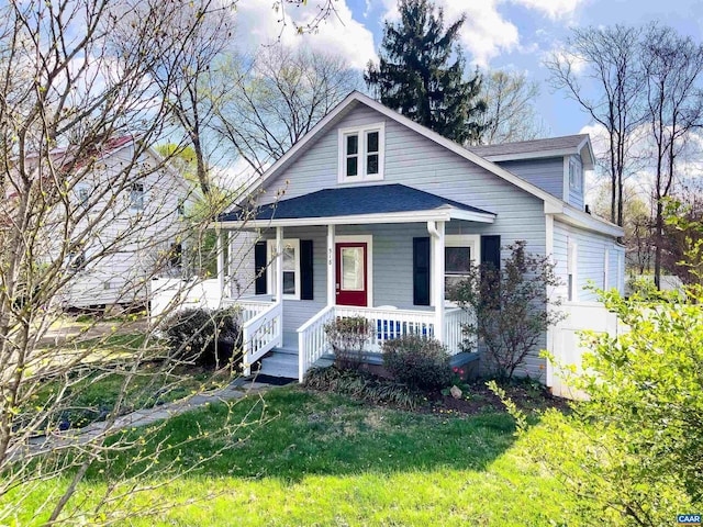 518 Meade Ave, Charlottesville, VA 22902 - bungalow with a front lawn, covered porch, and roof with shingles