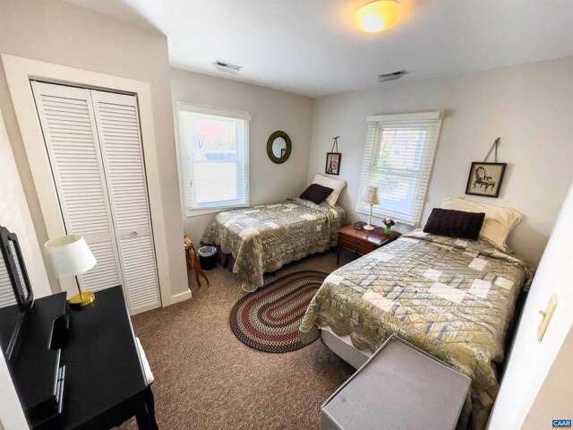 518 Meade Ave, Charlottesville, VA 22902 - bedroom featuring a closet, carpet flooring, visible vents, and baseboards