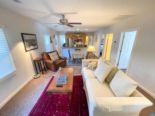 518 Meade Ave, Charlottesville, VA 22902 - carpeted living area featuring a ceiling fan and baseboards