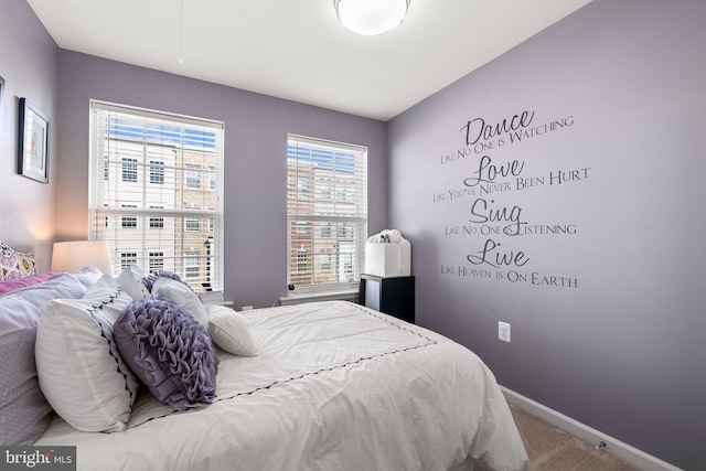 bedroom with carpet and baseboards