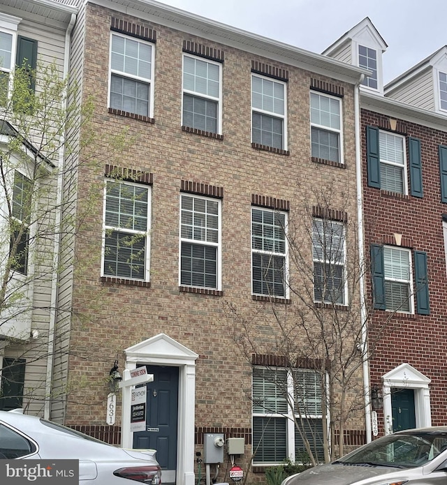 multi unit property featuring brick siding